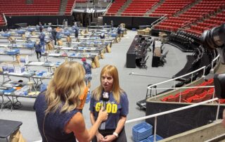 Redhead Marketing & PR president Hilary Reiter Azzaretti conducts a TV interview