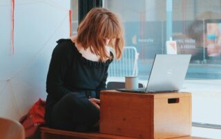Redhead using laptop